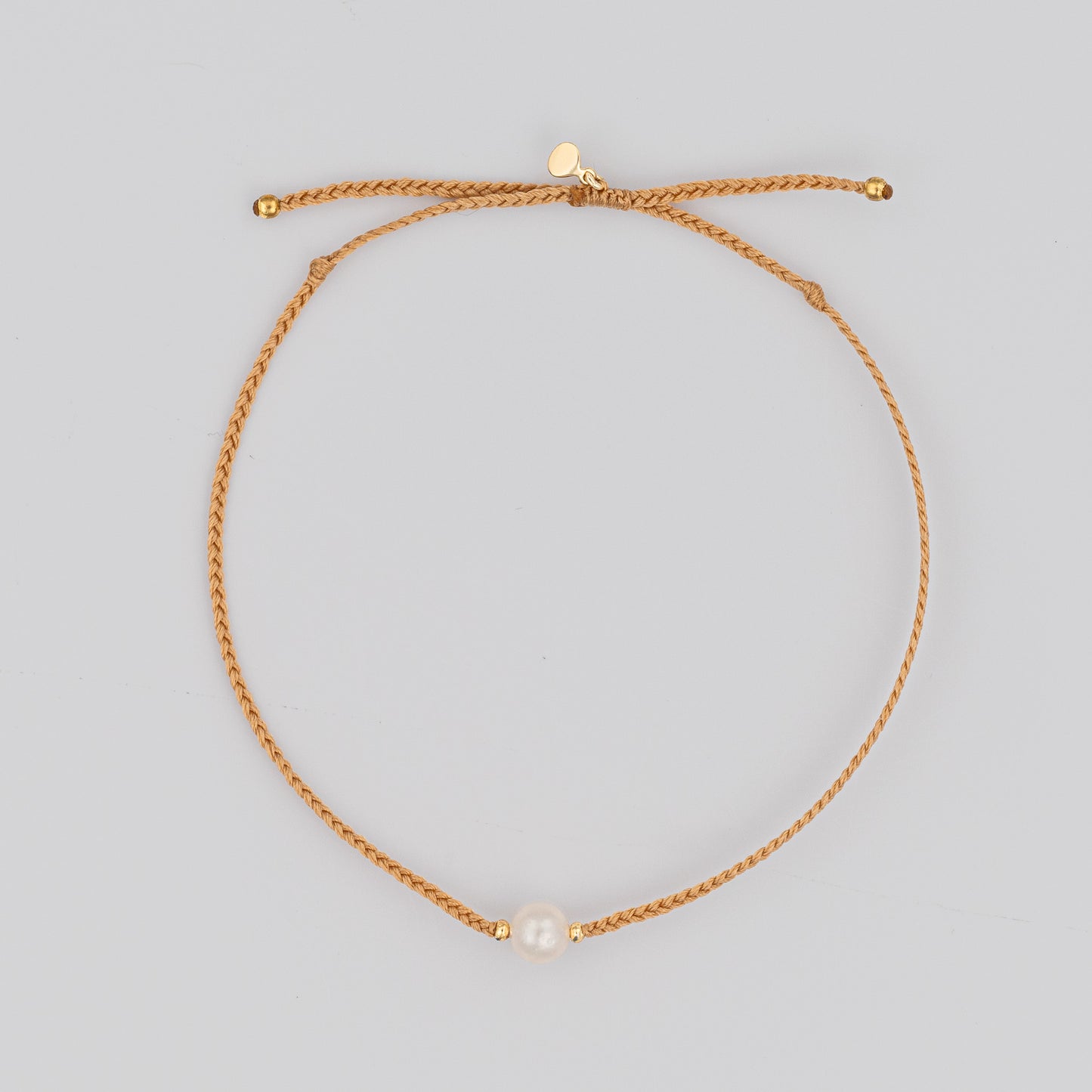 Load image into Gallery viewer, Single Pearl Bracelet on Woven Taupe Cord with Gold Accents
