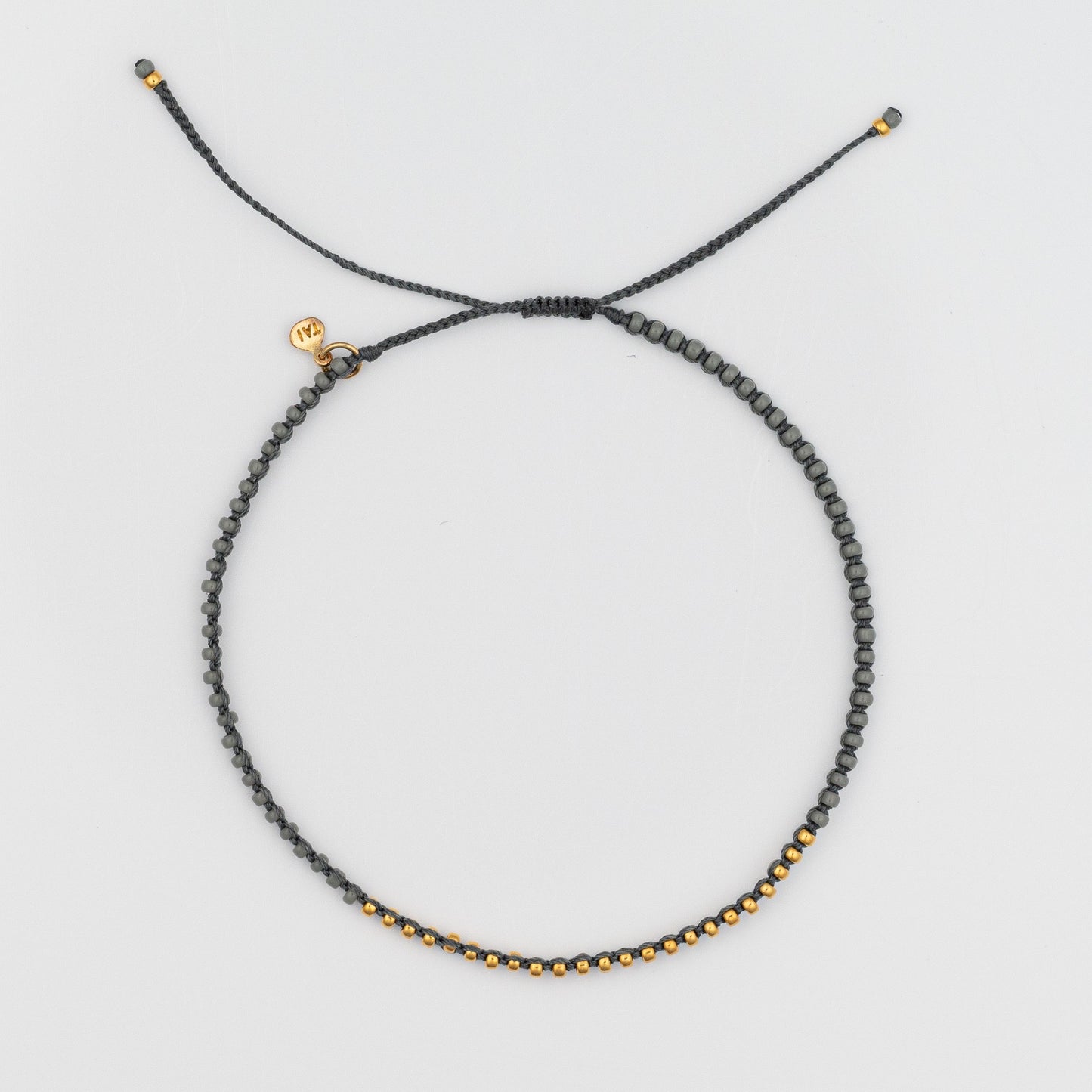 Load image into Gallery viewer, Braided Grey Bracelet with Gold Vermeil Seed Beads

