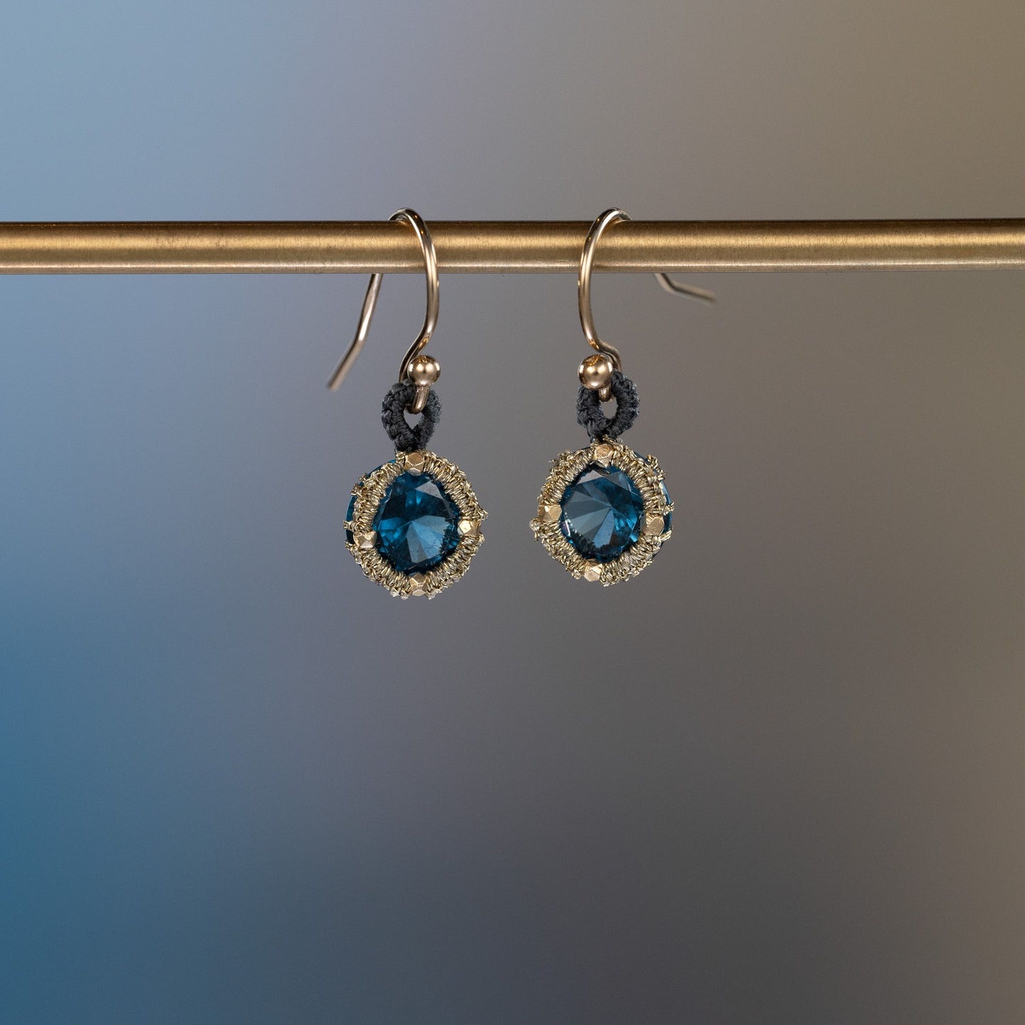 Load image into Gallery viewer, Danielle Welmond Caged Blue Zircon Drop Earrings with Grey Silk Cord Loop
