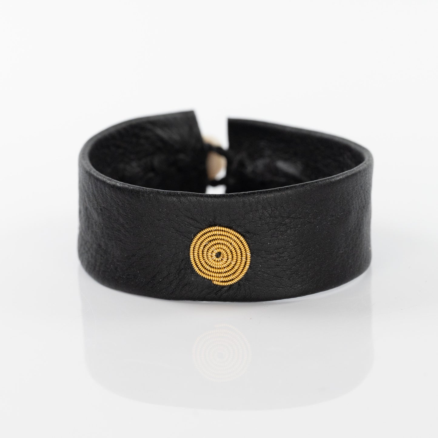Spiral Gold Circle Bracelet on Black Leather