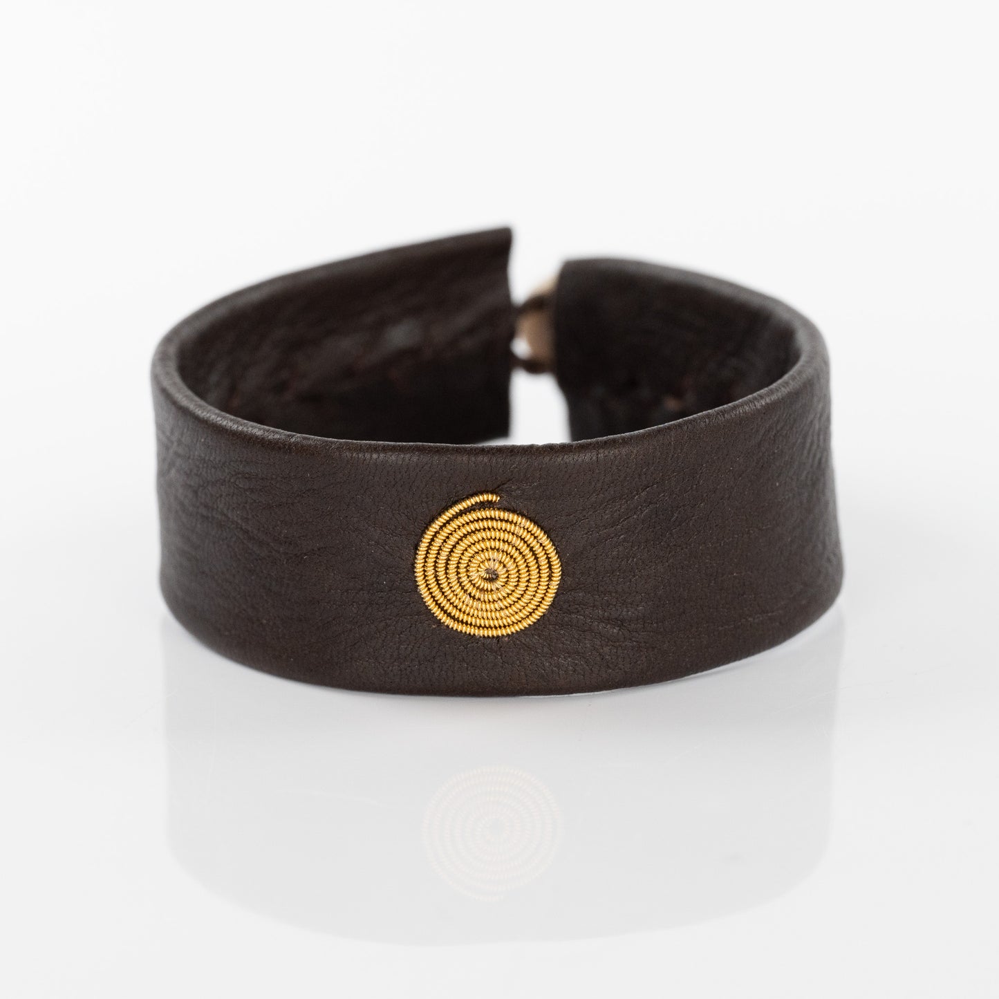 Spiral Gold Circle Bracelet on Brown Leather