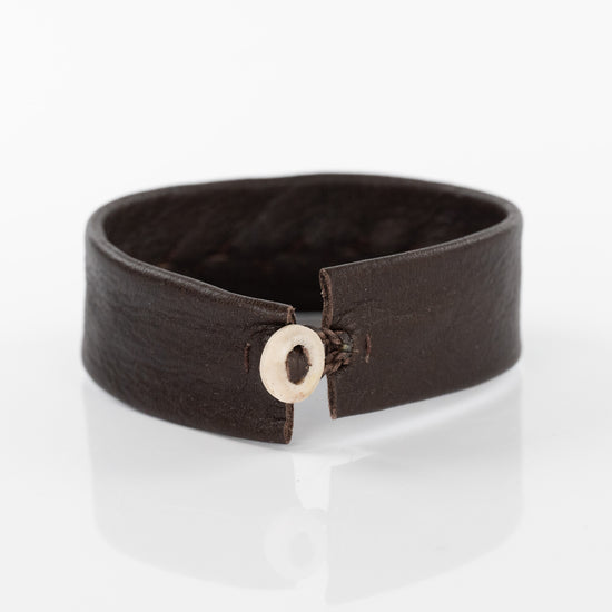 Spiral Gold Circle Bracelet on Brown Leather