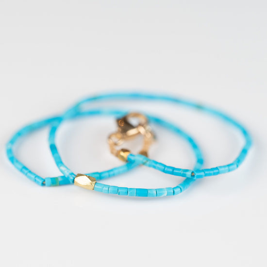 Load image into Gallery viewer, Heishi Turquoise + 23K Center Bead Bracelet
